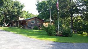 Just minutes from Buffalo National River and Tyler Bend state park is where you will find this rustic home that is nestled between mountains and creeks. Wildlife abounds at this home and includes deer, turkey, bear and occasionally elk. Enjoy your own peace and tranquility from either the oversized rock front porch that goes across the entire front of the house, or sit on the custom stone patios on each end. During the summer take a dip in the pool on the hot afternoons. Detached workshop as well as 2 car attached garage, so there is plenty of room for toys and hobbies. Great garden spot as well. Inside this spacious home you will find a stacked fireplace in the living area, breakfast area, and stainless steel appliances in kitchen. There is a large master suite, and a bedroom with