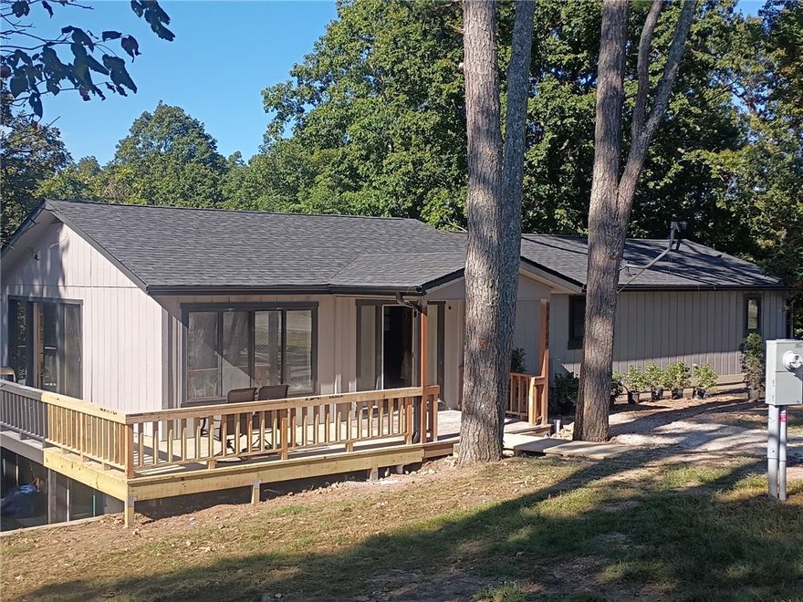 Lake living at it's best in a completely renovated home!  And a hunter's dream on 12 acres that backs up to Hobbs State Park.  New electric, HVAC, plumbing and all new finishes.  Floorplan allows for separate quarters with outside entrance downstairs.  Primary with bath + 2 bedrooms & bath on main floor. Large 10 x 20 sunroom off living room not included in square footage.  Separate 512 square foot shop/storage and a separate 120 square foot cabin/playhouse - both with electric.  Five minutes from public boat launch at Coppermine and 12 minutes from Rocky Branch.  This property has it all!