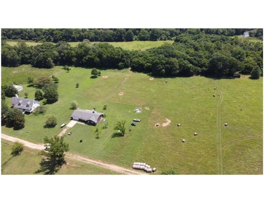 Discover 20+/- acres of private riverfront land in Siloam Springs with roughly 1,500 feet of direct Illinois River water access. The property sits almost exactly halfway between the Siloam Kayak Park and the Gypsy Camp & Canoe, offering an ideal location for outdoor recreation or short-term rental concepts. It is also about a 5-mile float down to the WOKA Whitewater Park, 2.7 mile drive from the WOKA trailhead, and only 5 miles from Highway 412 in Siloam Springs. The land includes open pasture, mature woods, and excellent opportunities for hunting, fishing, camping, and private river access. Nearly the entire property is in the floodplain, but Benton County allows development with proper elevation and approval. A rare opportunity to own significant, usable river frontage in Northwest Arkansas. Carroll Electric power is available at the road. Owner Financing Available.