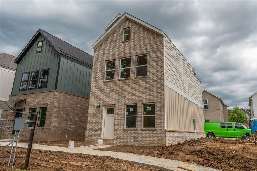 Brand new 2 BR/2 BA townhomes in south Fayetteville located close to U of A, Baum-Walker Stadium, The Ramble, Razorback Greenway, I-49, and all of Fayetteville's downtown area. This beautiful home features luxury vinyl plank throughout. The primary bedroom, kitchen and living area are on second level with the second bedroom and utility room on the first level. Kitchen has a pantry and both bedrooms have walk-in closets. Tub/shower combos in both baths. Third floor loft provides flex space. 2 car garage. Agent owned.