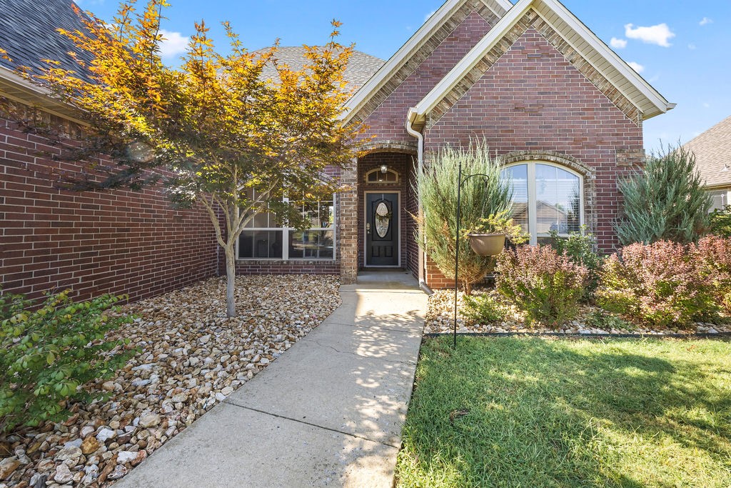 This beautiful 4 BD, 3 BA with study, 3-car garage in the highly sought-after Wildwood Subdivision. Inside are 12-foot ceilings, crown molding, and raised panel wainscoting with chair rail. The dining room has graceful archways, while the kitchen offers abundant cabinet space, a pantry, and a spacious dining area with tray ceiling detail. The primary suite is a true retreat, featuring a double tray ceiling, excellent natural light, French door access to the backyard, and a spacious bath with French doors, dual closets, and a walk-in shower. A private study with French doors provides flexible space for work or hobbies. Enjoy outdoor living on the deck overlooking open green space. The backyard also features a ready-made garden and peach, pear, and plum trees. Backyard access from both the family room and primary suite. Located close to community pool, Bright Field Middle, and Willowbrook Elementary, as well as the Community Center, Osage & Little Osage Creek Trails, all while easy access to DT Bentonville & XNA
