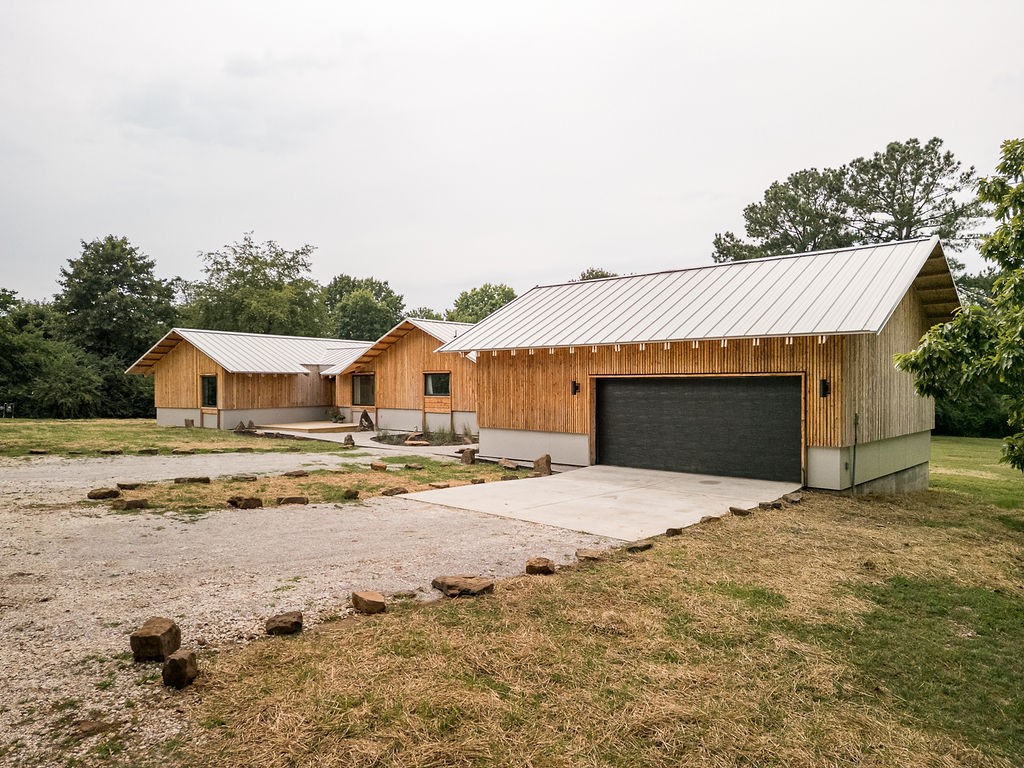 Architecturally designed home on a large lot in South Fayetteville. Offering privacy and a sense of seclusion, yet only minutes from dining, shopping, and the University. The 2,100 sq. ft. layout includes 3 bedrooms and 2 bathrooms, highlighted by a spacious primary suite. Originally built in 1961, the home has just undergone a complete transformation with a newly finished addition and full system upgradesānew HVAC, electrical, and plumbing. Custom cabinets, built-ins, wood flooring, and cedar siding are just a few of the design details that make this home stand out. Thoughtful details blend timeless character with modern convenience, creating a distinctive, high-quality home that is ready for everyday living and lasting enjoyment.