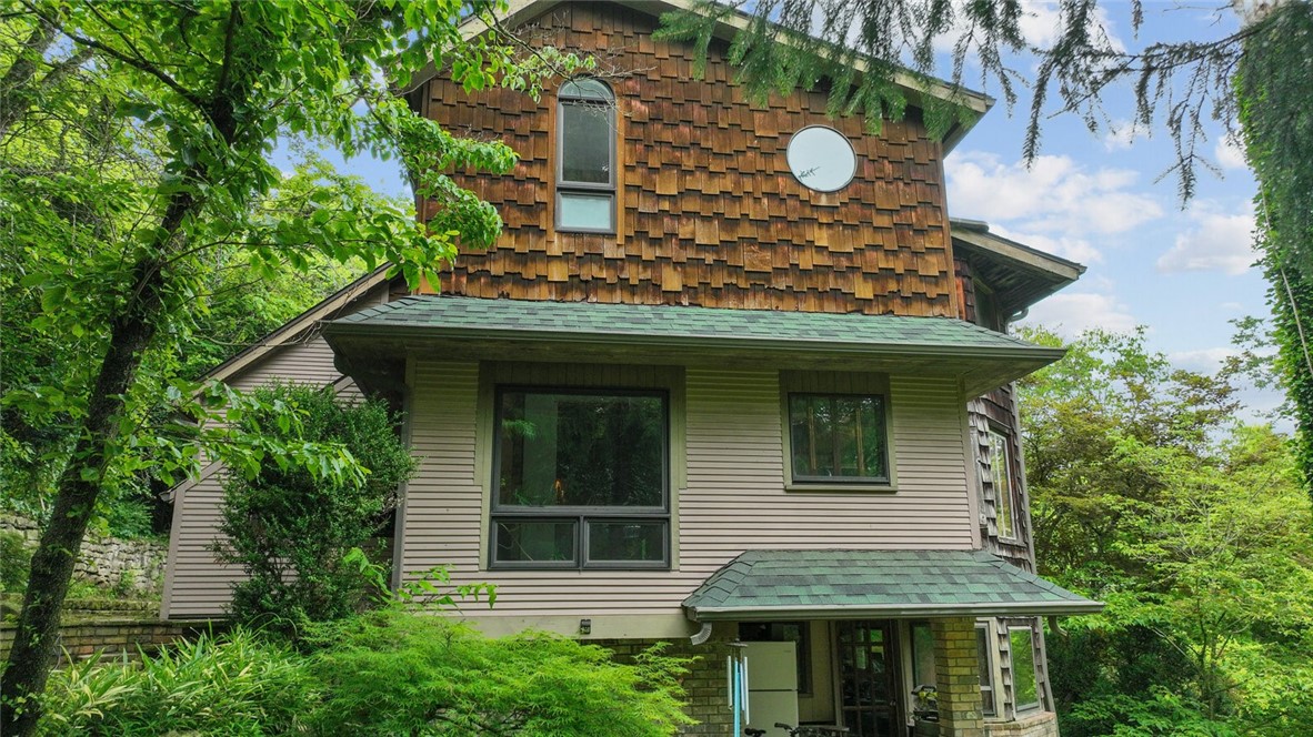 Quirky, Unique, Historic and totally Eureka ! This home boasts views of the Crescent Hotel and Magnetic Mountain. 7 minute walk to downtown, 4 street-parking spots, multi-terraced yard with stone pathways featuring 14 Japanese Maples, multiple Magnolias & Dogwoods, spring-fed fish & rock ponds and a yard hydrant to make watering easier and less costly. Arts & Crafts / Craftsman features throughout including Artisan stained-glass, antique doors, exposed wood beams, wine cellar and more. This is truly a Secret Gem that has been lovingly cared for and its waiting to be yours!