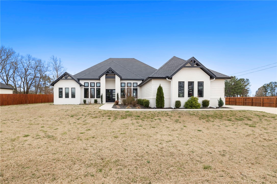 If you've been looking for a one-level, like-new East Fayetteville home, this may be the one youāve been waiting for! Situated on a fully fenced and privately gated +2/3 of an acre lot, this spacious, open floor plan features an oversized living, kitchen, and dining space, ready and waiting to entertain. The split floor plan includes a large primary sweet with separate shower and soaking tub, and large walk in closet. Three additional bedrooms - one with an ensuite private bath - are placed at the other end of the home. A fourth, large room connects to the back patio, and could serve as a perfect office, second living area, or playroom! Upgraded features include whole-home electric window coverings, solar powered driveway entrance gate, EV charging outlet in the garage, extended back patio, high-end kitchen appliances and faucet, designer wallpaper, and much more.