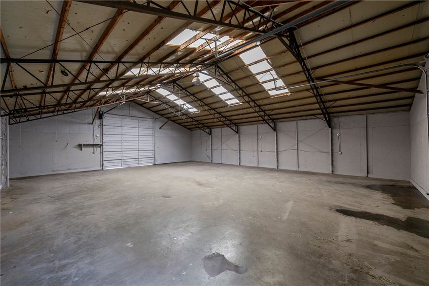 Prime commercial lease opportunity on E. Robinson with unbeatable visibility and right off of Hwy 412 East! This 2,000 SF warehouse is paired with secure fenced yard space, making it ideal for storage, distribution, or a wide range of business uses. The building is equipped with electricity, while water and sewer are available on site but not currently connected. Zoned C-2 commercial, this property offers flexibility and room to grow. Tenants are responsible for verifying requirements with the City of Springdale for their intended use. Attached documents for zoning. Front concrete pad area could also be for lease, inquire if interested.