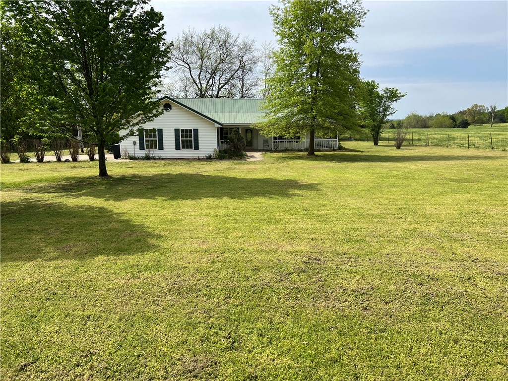 Are you ready to move out of the city (but not too far)? Check this one out. 1.84 acres close to town with Fayetteville, Siloam Springs or Van Buren not far away. This well maintained home has endless possibilities. If you have a big family there's plenty of room with 3 maybe bedrooms. How about work from home? Use the extra space for an office, crafts or game room. For those who like to cook, beautiful custom oak cabinets galore and plenty of counter space for prepping. Also, there is a separate pantry for all your groceries and cooking utensils to be tucked neatly away. An open floor plan makes those family get-togethers comfortable and relaxing. Make your appointment today!