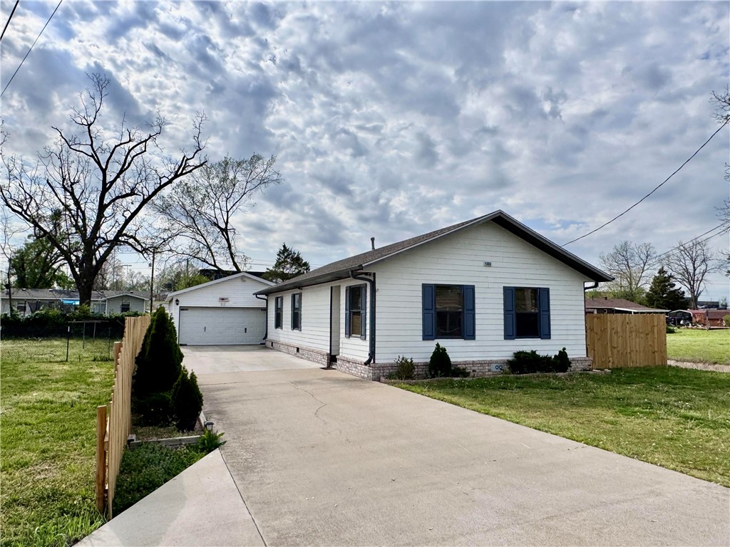In the heart of Rogers, this 3-Bedroom, 2 -bathroom home offers updated features throughout and is ready for its next owner. With 1250 SqFt of living space, the home has been freshly painted and boasts new flooring, updated bathrooms, and modernized cabinets. The new front door adds to the welcoming vibe, and the exterior is just as inviting with a new fence and a charming pergola. The large detached garage (850 SqFt provides ample storage or workspace. Situated next to Heritage High School, this home combines comfort, style, and a prime location making it perfectly suitable to also serve as an Airbnb. Enjoy the backyard and parks around the area.