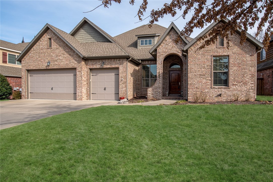 Gorgeous home in great location near all NWA hot spots! In the heart of the home, the living room embodies an open concept but feels cozy with brick fireplace. Hidden room behind built-in shelving. Bonus space includes a wet bar and sliding herringbone pattern sliding door. The bright kitchen’s shape allows for plenty of counter space, storage and room for helping hands. Built-in mudroom bench and secretary desk are unique elements. Bedrooms boast Jack & Jill bathrooms with private lavatories. Master bedroom feels luxurious under recessed ceiling finished in trim. En suite feels spa-like with extra long jetted tub and large walk-in tile/glass shower. Master closet features built-in dresser and hamper with laundry room access. Covered patio’s extended pergola is the perfect place to relax and enjoy the private backyard. Close to everything- I-49 access, the square, Crystal Bridges, trails, Amazeum, etc!