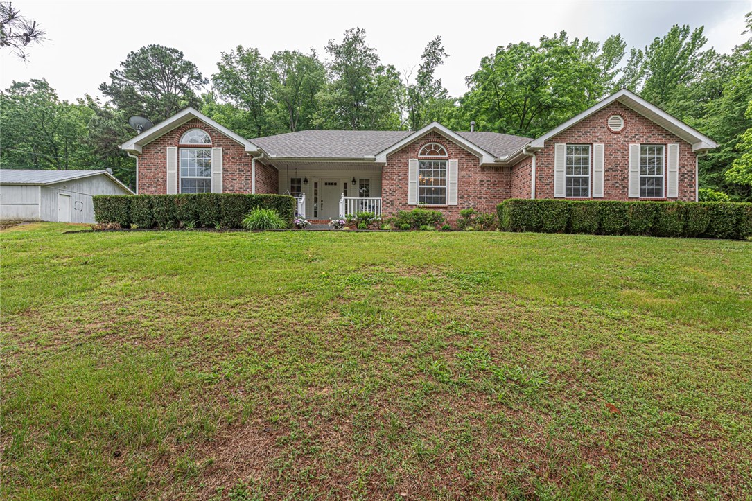 WELCOME HOME! This 3 bed 2 bath home on 2.27 Acres +/- is what youāve been looking for! Located 15 mins from Downtown Elkins, 45 mins from White Rock Mountain, & the Ozark National Forest! This brick home w/ mature landscaping & a covered front porch is the rural paradise you've been searching for! enjoy an open concept foyer & living room w/ tray ceilings w/ crown molding details, a gas fireplace, & cased openings! Host in the frml dining room w/ a vaulted ceiling & wood floors, & chair rail details. Enjoy the U-shaped kitchen complete w/ gas range,ample counter space, & white cabinetry plus an eat-in area w/ glass doors for natural light! Relax in the primary bedroom w/ a high ceiling & private ensuite bath feat separate sink vanities, linen cabinet, & shower! Enjoy an addtl 2 beds and 1 bath! Plus, a laundry room w/ cabinetry for addtl storage/folding space! Head to the back to the gently rolling lawn from the comfort of the patio! BONUS: This property feat a storm shelter & 30X30 shop! Donāt Miss Out! Act Now