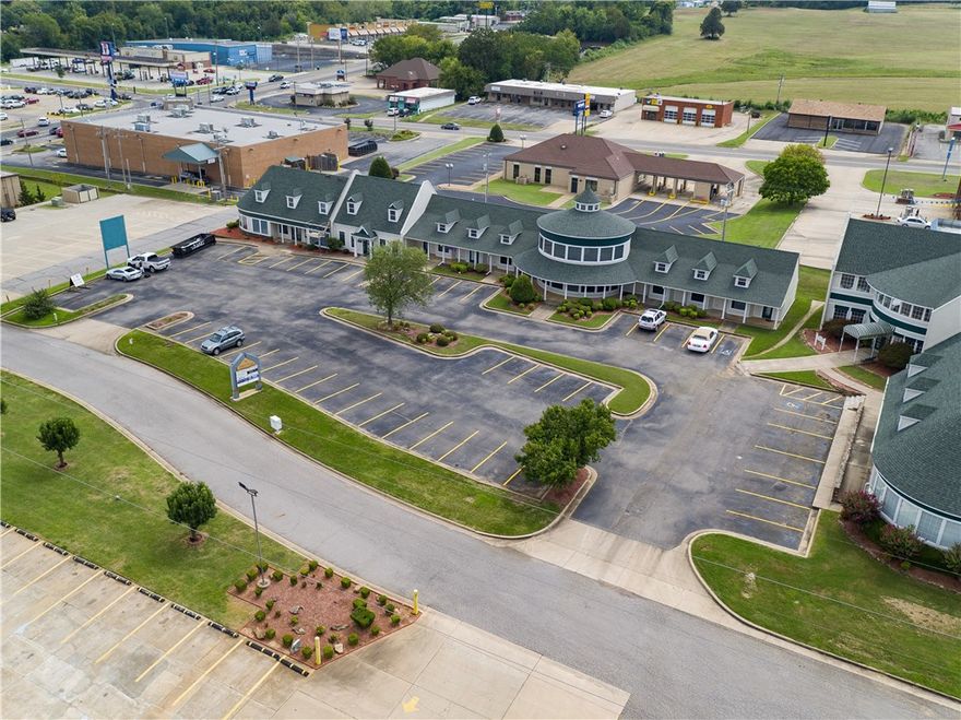 Buildings 105-117, sited on 1 acre, 12294 sq. ft. under roof. 32 parking spaces. 8 offices, all rented with annual income of $115,000