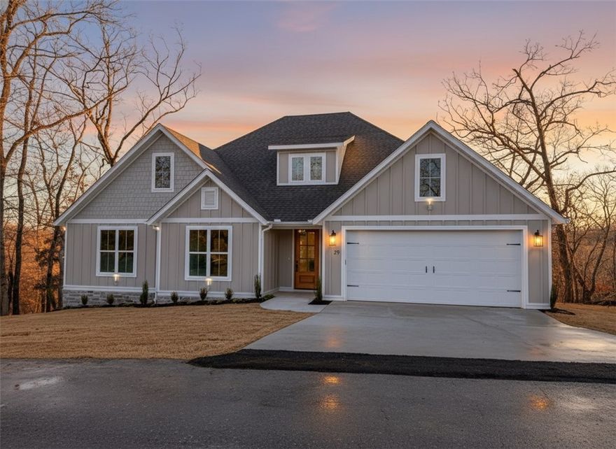 Thoughtfully designed and set on a wooded 0.53-acre lot, this 5-bedroom, 3-bath home features a spacious vaulted living room and entryway where abundant natural light enhances the open feel of the home. 
Refined finishes and functional living areas come together throughout the home, featuring custom cabinetry, ceramic tile, and rich wood flooring, while plush carpeted bedrooms offer a quiet, comfortable escape. The open, well-balanced layout provides flexibility for entertaining, family living, or home office use, with attention to detail evident throughout.

Surrounded by natural privacy yet conveniently located near shopping and daily amenities. This home offers a rare blend of upscale craftsmanship, space, and accessibility; ideal for buyers seeking quality new construction in a peaceful setting.