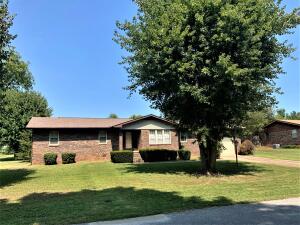 Brick home in great location! This all brick home features newer vinyl windows, newer dishwasher and gas cooktop, and the roof is approximately 3 years old. 3 bedrooms, 2 baths, den plus formal living room and a spacious kitchen with a separate dining room. The tub in the main bath has been replaced with a very nice walk in shower with glass doors. The 2 car garage has a storage room. With just a little updating, this would be a very nice home. Most of the furniture and all the appliances will convey! Sq Footage is per assessors office.