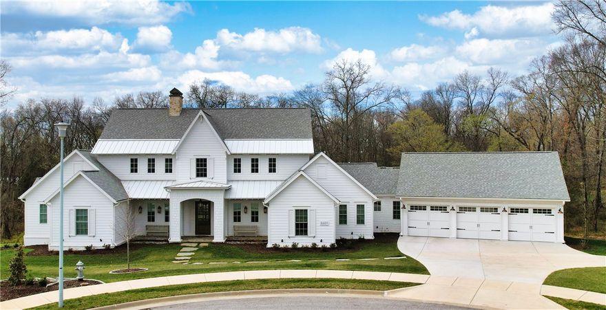 Stunning home in the coveted Scissortail Subdivision! Nestled at the end of a cul-de-sac on over 2 private acres, this home offers charm, custom design, and thoughtful details throughout. The kitchen is a masterpiece with endless built-ins, a large marble island, built-in Column Sub-Zero refrigerator & freezer, Wolf 6 burner gas range, spice drawer, storage closets & butler's pantry. The Primary Suite stuns with luxurious closets & heated bathroom floors. A second bedroom/office with an ensuite is also on the main level. Upstairs features two bedrooms, two bathrooms, and a living area with built-ins, a wet bar, mini-fridge, and surround sound--perfect for entertaining! Enjoy outdoor living with a built-in Blaze grill, a screened porch with a gas log fireplace, & a covered deck with Zurich no-maintenance decking. 3 HVAC units/tankless continuous hot water/green grass year-round fescue grass. Scissortail offers a gated entrance, clubhouse, adult & family pools, an exercise room, playground, firepit, & sports court.