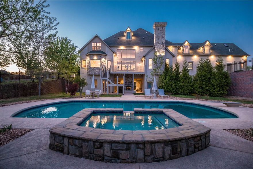 Exquisite, elegant, & distinctive estate in highly sought out Pinnacle Neighborhood. Over an acre prime corner lot, this unique home has flexible design that is ideal for all. This newly fully renovated home is 8,935 sq ft with a 868 sq ft attached guest apartment. This multi-floor home features a chef’s kitchen offering the highest level of appliances, 7 bedrooms, 7 full 2 half bathrooms and a finished walk out basement like no other; home theater, additional full kitchen, home office, wine cellar & more. Outside is an entertainers dream with an outdoor fireplace, heated gunite pool with waterfall & spa, pool bathroom, sauna & sport court.