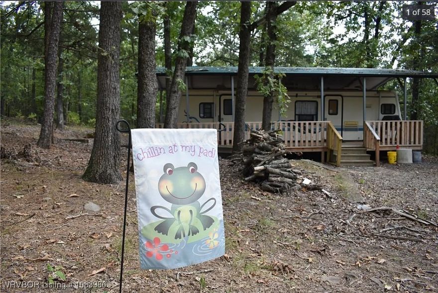 Secluded three acres and travel trailer. 1.2 miles to paved boat ramp at Ashley Creek park and campground and fabulous crappie, bass and catfishing on beautiful Blue Mt. Lake. Also water skiing, swimming and other water sports can be enjoyed. You're also at the doorstep of the Ouachita National Forest, the oldest and largest National Forest in the South, providing unparalleled hunting, hiking, mountain biking horseback riding, ATV riding, rock climbing and
many other outdoor activities. Deer blind and feeders are included. The travel trailer is fully furnished and functional. Mattress not include.
City water and electricity are on site. Fiber optic is available at the road. Separate hook up for additional travel trailer. The acreage is loaded with large mature pine, oak and other timber. A true outdoor person's opportunity at an affordable price to take advantage of all the wonderful outdoor activities available in this area.