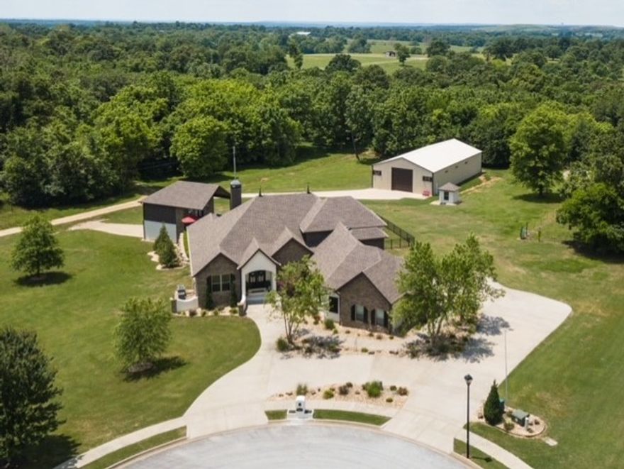 4 Bedroom 5 bath property, pool house, 3200 sq ft shop separate address and driveway entrance out of POA Jurisdiction. 830-38201-000 with a working well. 2 kitchens 1 is in the pool house. Full bathroom in the pool house and shop. 200 heated/cooled safe room complete concrete walls ceiling. Home has 2x6 exterior walls with extra insulation and for sound. 500 sq ft gym heated/cooled not in court house footage. Pool,Gym,Shop,Well,Home over 2 acres 2 separate properties only sold as one. Alarm,cameras,ring doorbell,sprinkler.