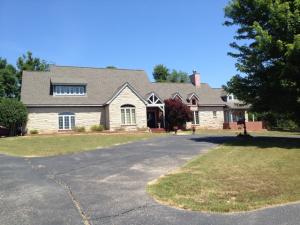 The most beautiful home setting on 11 acres in the middle of town. Open beam ceilings, hard wood flooring, swimming pool, manicured lawn, and a huge master suite are just a few of the perks of owning this home. This is a must see!