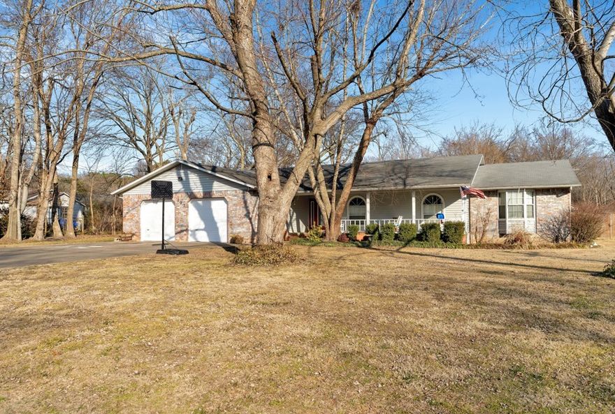 Mature trees on a double lot, this one owner well-maintained home offers a rare blend of comfort, charm, and room to grow-inside and out. Some updates done, including a new privacy fence (2023) and a new HVAC system and hot water heater (2022), making this home move-in ready. Gas furnace and a wood-burning fireplace provide warmth even during power outages-perfect for Arkansas winters. Inside, you'll find an expansive kitchen and living area ideal for gathering, along with a dedicated office space that's perfect for remote work, hobbies, or a reading nook. Step outside to relax on the large front porch or unwind on the screened-in back patio overlooking the large backyard. The double lot is a  standout feature-with plenty of room for a vegetable garden, a future shop or expansion possibilities. Whether you dream of homegrown tomatoes or simply wide-open space to enjoy, this yard delivers. Full of extras, space, and potential, this special home is ready to welcome its next chapter.