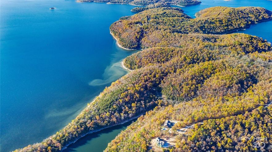 Rare opportunity to own a retreat of incomparable serenity, privacy, and natural beauty with approximately 2300 feet of lake shoreline with most areas Corp line to the water. Accessed by a private gated drive, these 36.47 acres feature expansive breathtaking views of Beaver Lake followed with hills offering diversity of topography and elevation. This property would be great for development or multiple home sites with direct access from a paved road. Property includes 1 boat slip in a community dock. Close to Lost Bridge Village and Airport.