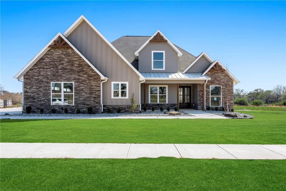 Stunning New Construction with a Best-Selling Floorplan in the sought after Big Sky Subdivision! All the quality and extras you expect throughout from one of the top builders in NW Arkansas. Large light-filled open living space featuring a gourmet kitchen with huge island, tons of cabinets, double ovens, gas cook-top and butlerās pantry. Downstairs also features the Master suite, formal dining, office or optional 5th bedroom. Upstairs features 3BRS, 2BA and large media/game room with built-in wet bar. Covered back patio, complete home security system and smart home wired. Professionally landscaped, sodded yard and sprinkler system. Home is complete and move in ready! No time to wait!