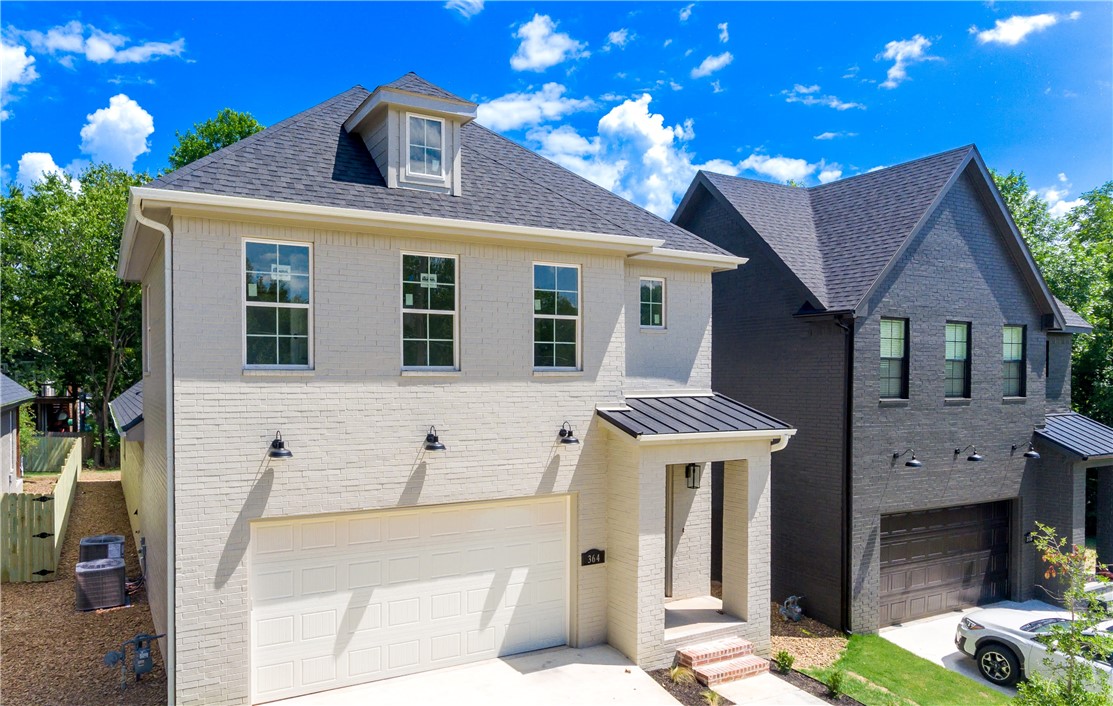 Brand new home in Downtown Fayetteville just wrapping up! Walk to Feed & Folly, Farmers Market, Fayetteville Square, Onyx Coffee Lab, Hugo's, Vetro 1925, Dickson St, Jammin Java, Vault, Maxine's Tap Room, and many other Fayetteville staples! Only minutes to the U of A! This home features an attached 2 car garage and private backyard with covered patio (rare for this close to downtown!) Other features include, a spacious open layout, primary bedroom on main floor, stunning hardwood floors, premium quartz countertops, large kitchen island, high end 36 inch gas range, custom built cabinets reaching to the ceiling, freestanding soaker tub, large shower, covered back porch overlooking mature trees, and so much more! Don't miss out on this amazing property in the heart of downtown! More interior photos coming soon.
