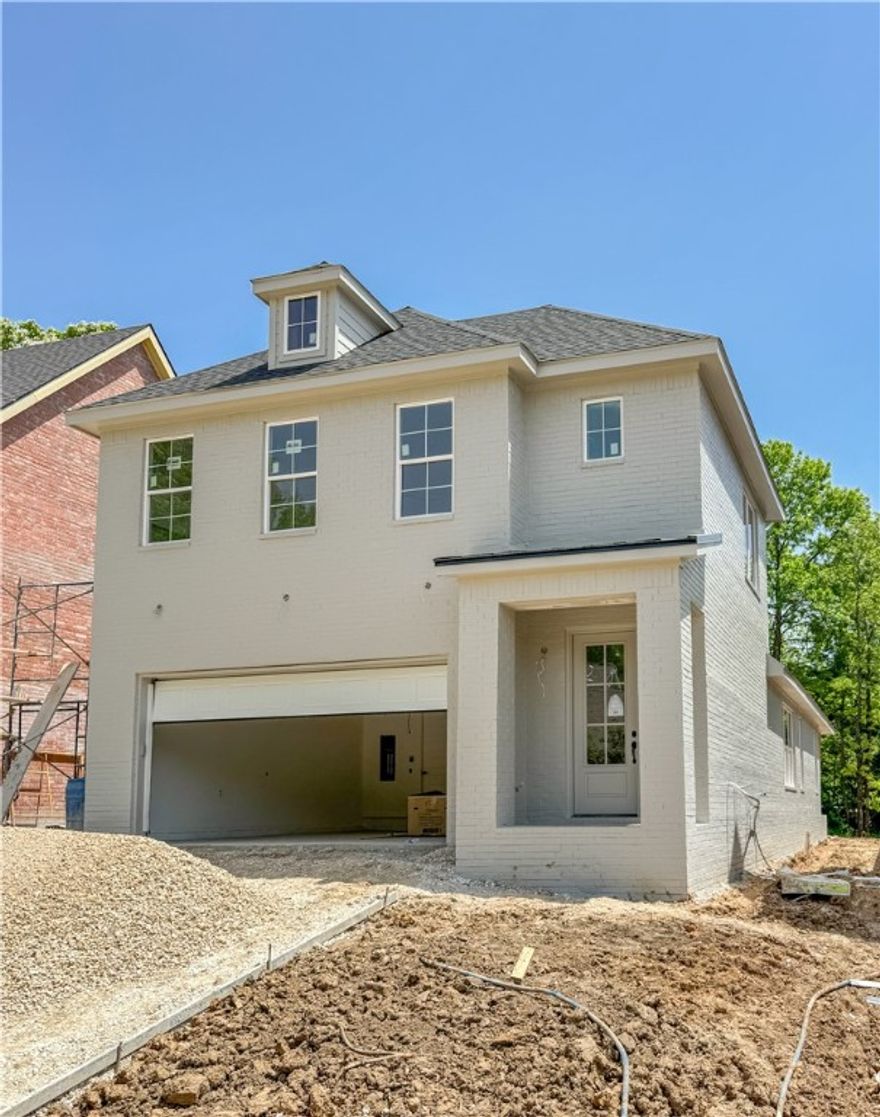 Brand new home in downtown Fayetteville with an attached 2 car garage and private backyard! Property is surrounded by mature trees and within walking distance the Fayetteville Square / Farmers Market, Coffee shops, numerous dining options, shopping, and more! Get in now to pick your colors and finishes! Home features 3 spacious bedrooms all with their own bath, a half bath for guests, hardwood floors, quartz counter tops, custom built cabinets, large kitchen island, natural gas range, primary bedroom on main floor, a cozy covered back porch, and so much more! The open concept plan is perfect for entertaining or quiet nights at home, while the proximity to the Square, University of Arkansas, and Dickson makes it perfect for taking advantage of all the great attractions Fayetteville has to offer!