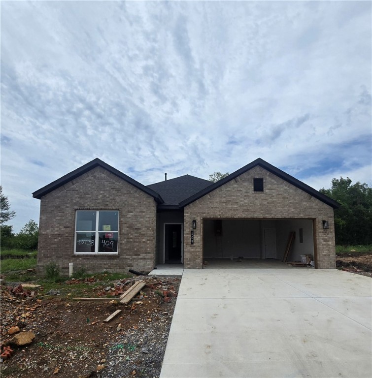 Welcome to Heritage Ranch, Phase 4! This new phase is presented by an award-winning builder with over 35 years of experience in Northwest Arkansas, committed to delivering quality homes for years of enjoyment. This home features three spacious bedrooms, two bathrooms, and an open kitchen seamlessly flowing into the dining and living areas. It boasts a vaulted ceiling and a cozy fireplace. Enjoy stylish finishes and amenities, including brick and hardie siding, cedar shutters, full guttering, LED disk lighting with fan and light kits in all bedrooms, a spacious kitchen island with pendant lights, 3cm quartz countertops, a smart thermostat, a Frigidaire Gallery appliance package, and more! This home combines style, comfort, and the convenience of nearby schools, shopping, and other amenities.