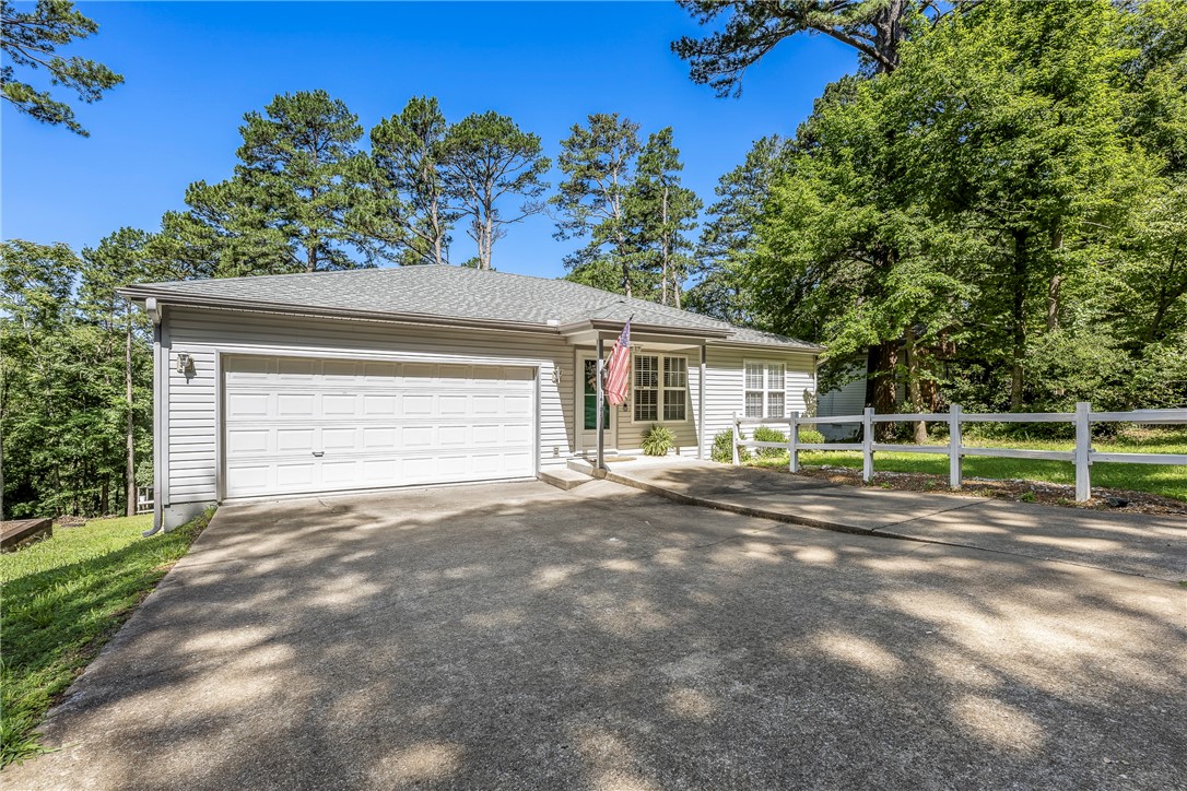 Looking for affordable lake area living? This home is for you! Oozing charm and recently remodeled, this great home features 2 bedrooms, 2 full baths, an updated kitchen with new appliances, new cabinets and butcher block countertops, and a new roof. It also boasts a new partially covered deck - perfect for entertaining or just enjoying the peaceful setting and wooded view. If you enjoy being on the water, there's a community boat launch/lake access at the end of Hickory Dr. Perfect for weekend getaways, full time living or short term rentals. This one is just too good to miss!