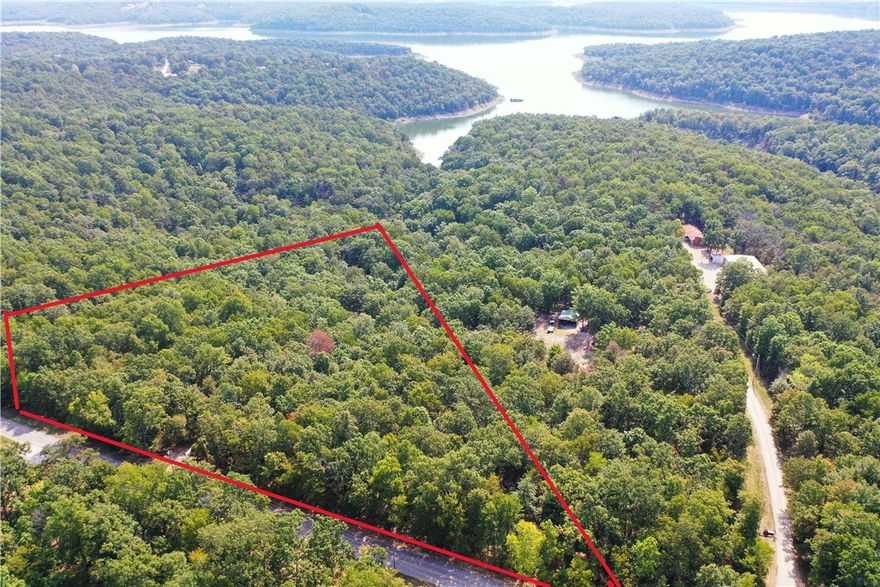 11.2 AC m/l Estate Lot bordering Corps land on Lake Norfork. A nature lovers dream with abundant wildlife to include deer ,turkey, eagles, and more. Domestic water line, sized for fire protection, available in roadway. High speed internet available. Property has had preliminary soil testing for septic system. Paved county road frontage which dead ends at lake. Lots sit well above lake, and well above the Corps flood zone. Protective covenants in place. Possible lake view with some clearing. Less than 10 minutes to Tracy Marina; 15 minutes to downtown Mountain Home.