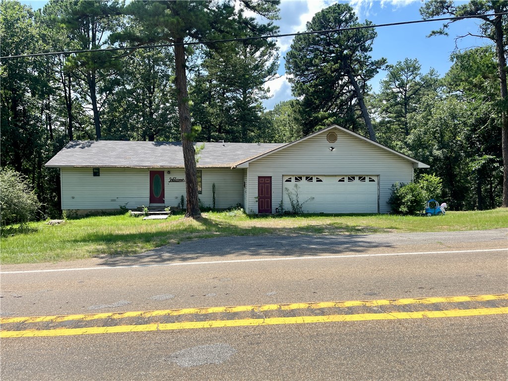 Looking for the right investment house to flip, make it your own or even fix up to make a great rental? Make sure you book your private tour of this property that sits on about 6 acres to enjoy with nature to enjoy in the back yard with a wet weather creek running through it. The upstairs has a 1 bedroom & 1.5 bath plus additional living room/den & the basement also has another bathroom. This property has lots of great potential to be had with your vision just Minutes away from town & Lake Ludwig. Don't delay & book your showing today.