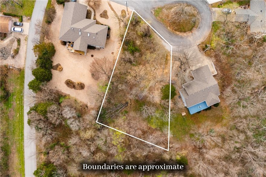 Discover the ideal canvas for your future home on this gently sloped cul-de-sac positioned between two homes. The property has a wide entry access and a picturesque park-bench/swing structure. Located near Bella Vista's renowned recreational opportunities, including lakes, golf courses, parks, and miles of scenic bike and walking trails, this lot delivers convenience to enhance your lifestyle. Whether you're a builder, investor, or future homowner, this property provides opportunties to build on a quiet street while in close proximity to all NW Arkansas has to offer.