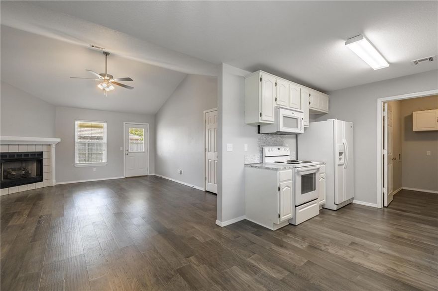 NEW ROOF just installed and First American Home Warranty offered. Unbeatable Location! Steps from Trails & Close to the University of Arkansas. Enjoy the best of Fayetteville living in this charming all-brick home with direct access to miles of scenic trails—right outside your front door! Bike to Centennial Park. The living room features soaring cathedral ceilings and a cozy gas-log fireplace, perfect for relaxing or entertaining. In 2023, beautiful engineered hardwood flooring was added throughout the living area, kitchen, and primary bedroom, giving the home a fresh, modern feel. Recent updates include: Popcorn ceilings removed Fresh interior paint Stylish new light fixtures Updated sinks, faucets, and a new dishwasher. Enjoy a private, fenced backyard. Whether you're a student, faculty member, or simply looking to enjoy Fayetteville’s vibrant trail system and nearby parks, this home is a rare find in an unbeatable location.