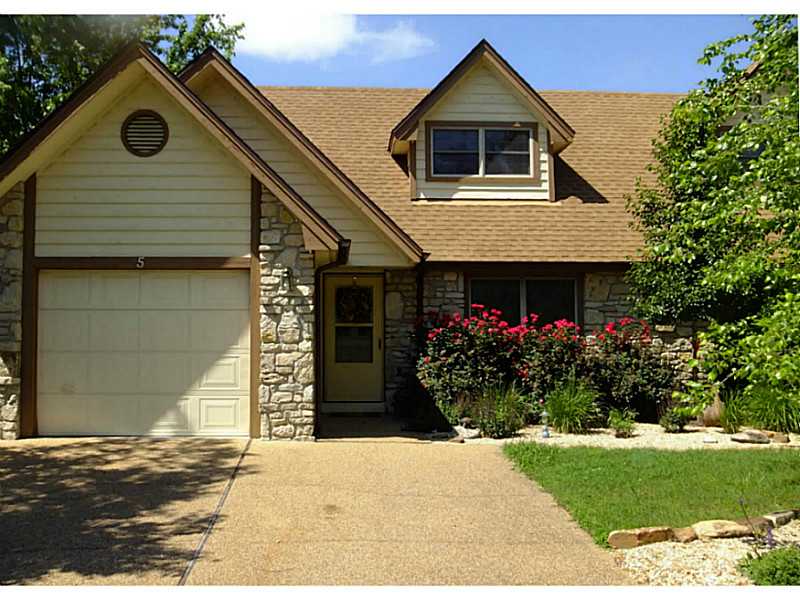 Golf Front Town Home. Beautifully landscaped overlooking golf and water. Main level enjoys MBR, LV, Kitchen and rear deck. Second level used as 2nd BR and media room/office. Heat Pump/ water Heater new.,Home immaculate and in like new condition. Holiday Island enjoys 27 holes of golf, recreation and marina on Table Rock Lake. Medical and shopping near by.