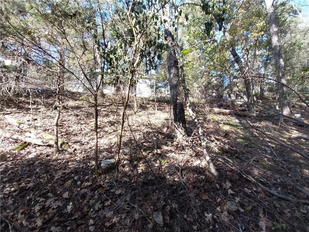 This expansive 0.97-acre lot sits minutes away from Highway 62 in Eureka Springs, AR. Offering with another 0.50-acre property, totaling 1.47-acres. The property features open zoning, so you are free to do with the property what you'd like. Mobile and modular homes are allowed. Within the Eureka Springs School District. Electricity is nearby. Seller Financing options available!