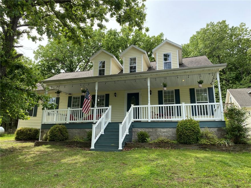 Experience refined country living on 13.1 private acres just outside Berryville. This beautifully maintained 4 bed, 3 bath home offers the perfect blend of comfort, space, and timeless charm.

The designer kitchen features granite countertops, stainless appliances, hardwood floors, a walk-in pantry, and a custom coffee bar, opening into a warm and inviting living area with a corner gas fireplace.

The main level hosts a spacious primary suite, two guest bedrooms, full bath, and laundry. Upstairs offers an additional bedroom, full bath, and a versatile bonus/game room ideal for entertaining or relaxing.

Step outside to your own private retreat with mature trees, manicured landscaping, and a custom outdoor fireplace—perfect for gathering under the stars.

No restrictions allow for endless possibilities while enjoying peaceful, upscale country living.