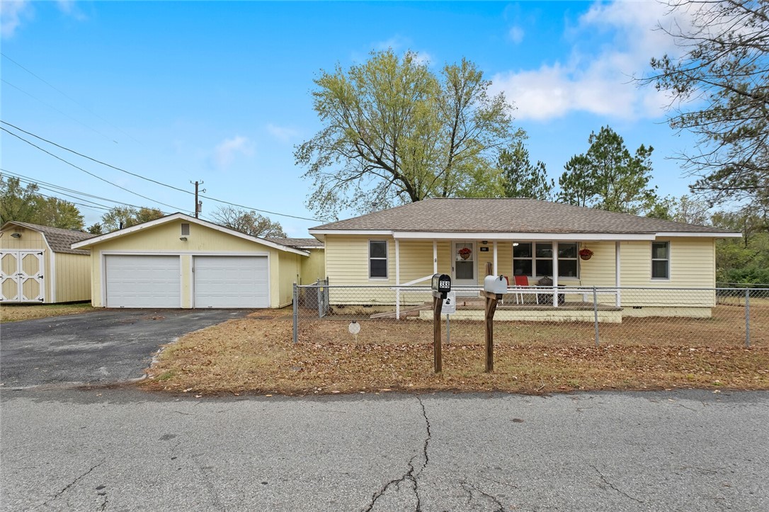 Charming home in the heart of Centerton! Situated on a flat corner lot this home has 3 bedrooms, 2 full bathrooms, and an oversized two car garage with a storm shelter! The yard is fully fenced back, side, front, and includes two storage buildings. Major systems have already been replaced, HVAC in 2023, roof in 2021 and water heater in 2022. Whether you are looking for an investment opportunity or a move in ready home, this one is it!
