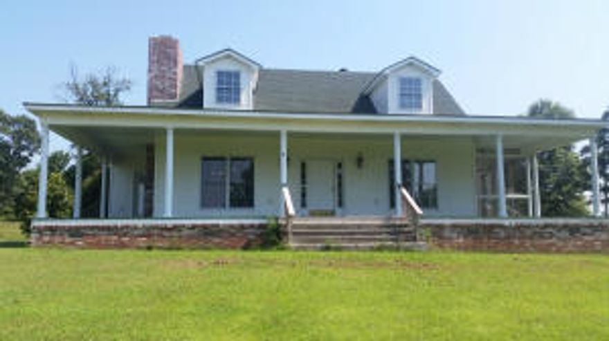 View, View and more Mountain views. Enjoy your morning coffee or your afternoon lemonade from the back porch, the front porch or the screened in porch off the master bedroom. This home offers 3 bedrooms, 2.5 bathrooms and office. The living room has a brick fireplace and opens up to the kitchen and dining area. All this sits on 15.71 acres and 2 large out buildings once used for a packing house.