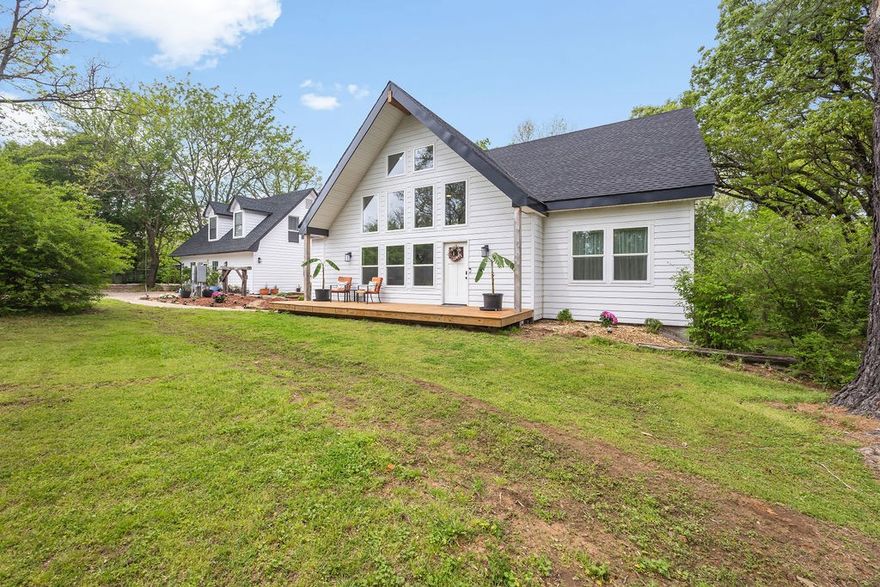 Spectacular property nestled right on the Illinois River! Meticulously designed with comfort and luxuries in mind. Glorious sunlight pours through providing warm and inviting ambiance throughout. Entertainers delight providing room for everyone with beautiful main house, convenient apartment, cozy glamping tent and splendid treehouse. Amazing amenities that offer everything one could ask for including large chicken coop, carport, 2 barns, storm shelter, raised garden beds and greenhouse. Magnificent and serene setting with stunning views, mature landscaping, various fruit trees and plants. Short walk to the babbling river to enjoy summer activities and relaxation. Your own personal oasis or an excellent investment opportunity! Airbnb income from the treehouse and glamping tent brought in over $40,000 last year! Less than 10 mins to I-49 and 15 mins to University of Arkansas. Escape into tranquility!