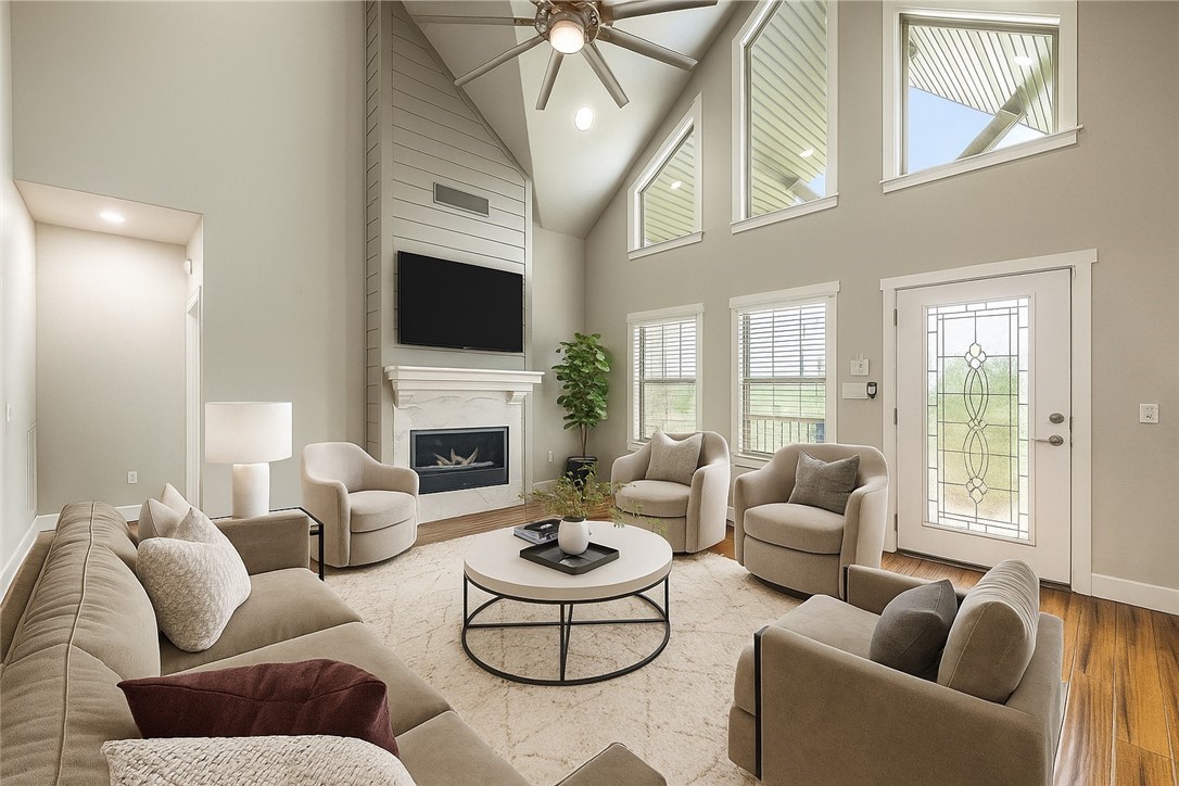 Set on over 1+ acre w/ serene views of open pastures, this home offers a blend of space, function, and style. In 2019, extensive renovations brought new life throughout: the kitchen was completely remodeled with granite countertops, custom cabinetry, updated lighting, stainless appliances, added cabinets, and a redesigned pantry. The main bathroom now features new: tile, frameless glass walk-in shower , soaker tub, cabinetry, and granite. A 2nd bath was reconfigured with a new walk-in shower, and the laundry room was upgraded with new tile, cabinetry, and a utility sink. Fresh paint was completed throughout the home the same year. The in-ground pool was enhanced in 2024 with a new liner, pump, and stairs, designed with a deeper center for swimming and lounging. Outdoor living is extended with a wraparound stained deck and a pergola added in 2023. A half bath in the unfinished basement offers easy access for pool guests. Distance Springdale, Fayetteville-15 minutes & Rogers/Bentonville 30. Elect. in storage bldg.