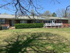 Beautiful view of the Ozark Mountains sits this 4BR 3.5 BA Brick home, Mother-in-law quarters attached with Basement ranch home, sitting on 41.69 Acres. Shop.