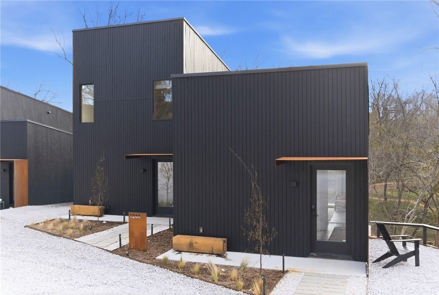 Modern creekside cabins just 1 mile from Bentonville Square! Perfect for investors, corporate buyers, or
young professionals seeking downtown access with the ability to offset cost of living. Each parcel includes
2 dwellings (6 total across 3 lots / 0.58 acres) backing up to Black Apple Creek with waterfall and trail
views. R-2 zoning with new sewer and utilities, shared access drive. Suite 1: 376 SF studio 1 bath. Suite 2: 892 SF 2 bed 1.5 bath. High-end finishes include cedar rainscreen, concrete floors, stainless appliances,
and high-efficiency cassette mini-splits. Buy one parcel or all three at a portfolio discount. Buyer to verify
all details.