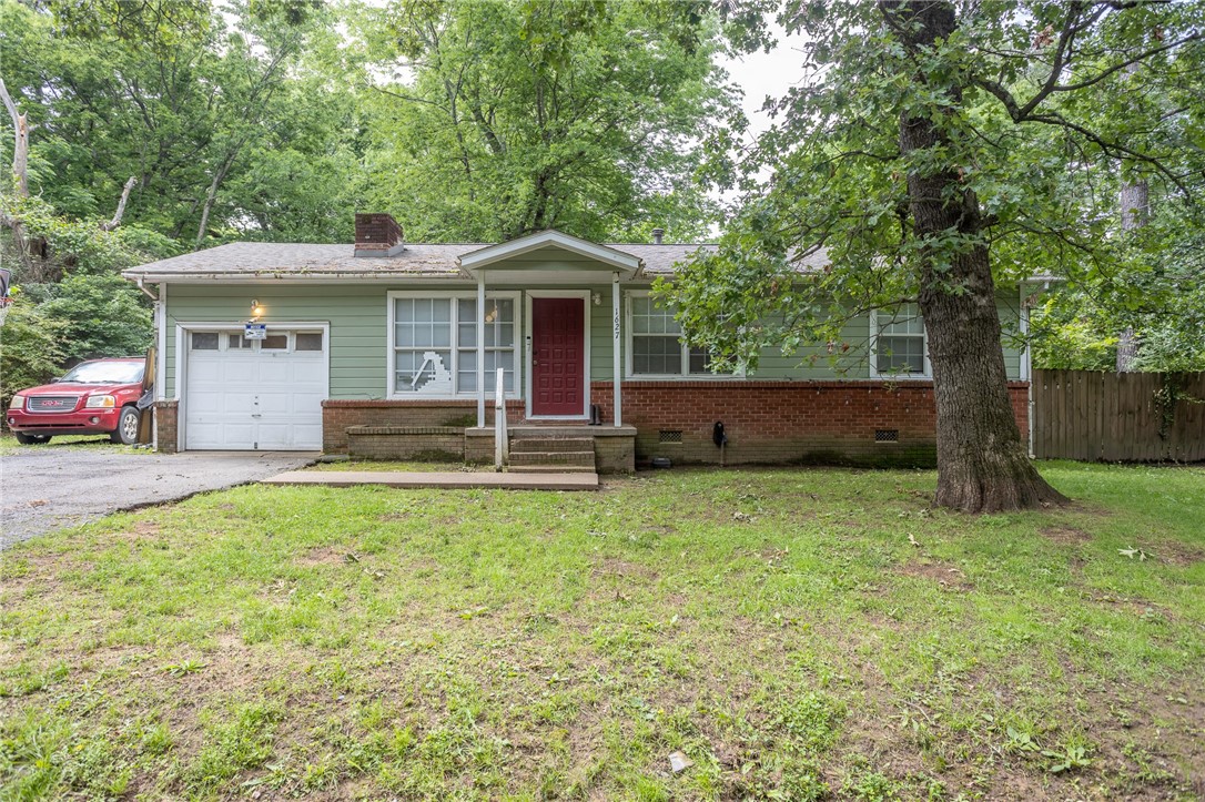 Just in time for the upcoming spring semester, this home is ideally located for the student living. With direct access to Fayetteville's many trails, you can bike out your front door and be on campus in a matter of minutes. Hate exercise? Make the short walk to the nearby transit stop and let the bus driver do the work. So investors and parents with incoming university students will love this place for those reasons, while those looking to stop with the rent payments and buy a little place of their own in the middle of town might also want to have a look. Situated on a quiet, almost secret, little dead end street, surrounded by trees but close to ... like, just everything. End of list. If you want it or need it, city convenience is close by, but you'd never guess it when you're out grilling in the back yard or taking in a moment in the front gazing out into the woods across the street. The home is being sold as-is, but with a little cosmetic love this place can really shine!