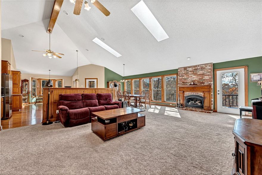 Looking for the perfect home + income producing property?  This charming cedar home on .84 acres with seasonal views of Loch Lomond and beautiful natural surroundings has a large, open concept living area featuring vaulted ceilings with exposed beams and skylights. Enjoy quality craftsmanship throughout. The gourmet kitchen includes a café-style bay window and opens to a screened porch, perfect for relaxing or entertaining. The main level features 2 bedrooms plus an office.  The lower level can be used as a private apartment perfect for a long term tenant, short term rental or extended family member. The basement apartment has been consistently rented for $1400/month. It has its own entrance, one-bedroom, full kitchen, a nicely appointed living room, a full bath, and its own laundry room with a private covered deck. The expansive decks provide outdoor living at its best. This well-designed home provides the perfect space for those with multigenerational living or someone looking for an income producing property.