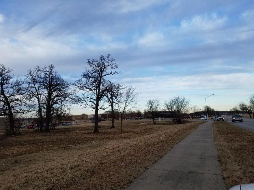 3.21 AC corner lot. Great location with easy access to I-49 and the new fly-over. Surrounded by development, Target across the road.