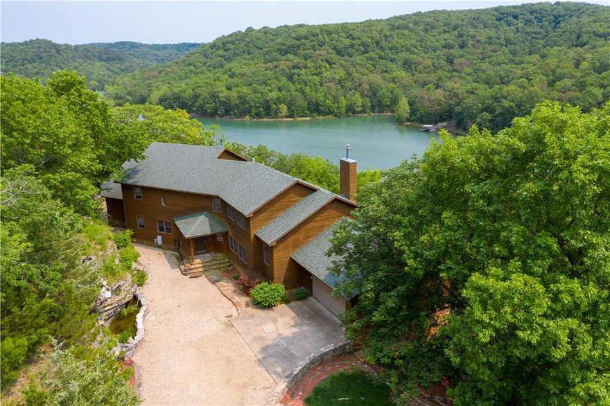 Beautiful house located on Beaver Lake with wonderful views.  House is being sold with all furnishings, boat slips and dock.  This house has been professionally maintained and rarely used.