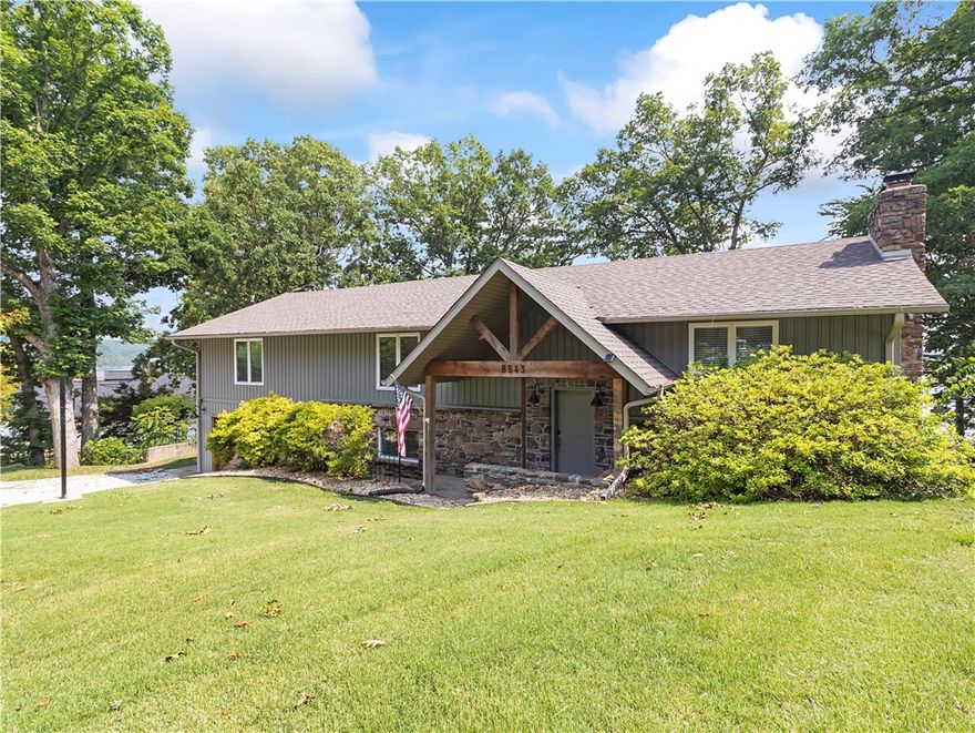 Are you looking for spectacular unobstructed lake views, the ability to walk to the waters’ edge from backyard or a completely remodeled 4 bedroom plus bonus room, 3 bath, lakefront home and a private dock? Come see this Beaver Shores Beauty, it has glorious attention to detail, vaulted ceilings in main level living space and primary bedroom also both have lake views, actually three bedrooms with lake views, two primary suites too. Cozy up to fireplace in the winter, lake views from recessed hot tub, very large multi-level deck perfect for entertaining. Remodeled down to studs, all new electrical, plumbing, siding, roof, hvac, deck, cabinets, counters, flooring and no carpet, everything is new! Even new baffles in septic and serviced when purchased. Very gentle stroll to private dock, approved for solar, boat hoist and swim platform, great place to end the day, extra slip available. Convenient less than 15min to Downtown Rogers or to Hobbs State Park for hiking/biking trails. Home is a producing airbnb, call today!