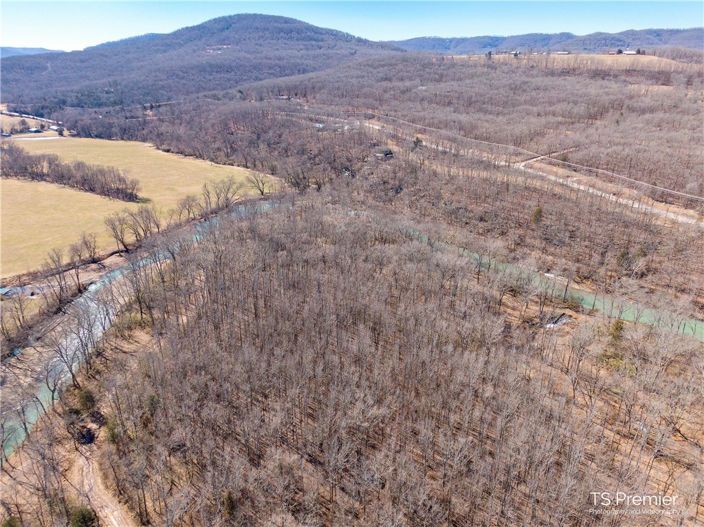 Rare find! The perfect getaway spot with private white river access. Just 20 minutes from Fayetteville, its the ideal place to unwind and leave the stress behind. Beautiful hardwoods with multiple places to build a cabin. Would make a great hunting or fishing camp. Wake up and toss your kayak right in! Four different 40 acre tracts available, for a total of 160 acres. None of the tracts touch the white river, but upon purchase of any of the tracts, buyer will gain legal access to 22 acres along the White River for camping, fishing, etc. This 22 acres is just a short drive from the tracts for sale, less than a mile, and is collectively owned by a small group of nearby landowners. The land is next to River Meadows, it has a 50' utility easement.
