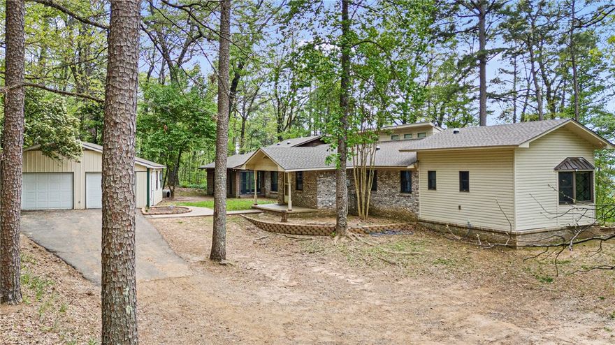 Nature Lover’s Retreat – Private Homestead Minutes from Town
Tucked away on a secluded country road just minutes from town, this one-of-a-kind rural sanctuary is a dream come true for nature lovers, homesteaders, and anyone seeking serenity. Thoughtfully designed with a smoky, moody aesthetic, this near self-sufficient home offers the perfect blend of modern comforts and off-grid living.
Enjoy ultimate privacy and security with your own private hunting grounds, two private wells connected to a holding tank with whole-house water filtration, and a reliable backup generator. Eco-conscious features include radiant heated marble floors, tankless water heater, energy-saving solar daylight tubes, and an efficient whole-house fan—perfect for reducing your carbon footprint while staying cozy and comfortable. Adventure awaits just minutes away in the breathtaking Ozark National Forest—perfect for hiking, scenic drives, or exploring your own slice of wilderness with the Illinois Bayou just a short hike from your door.