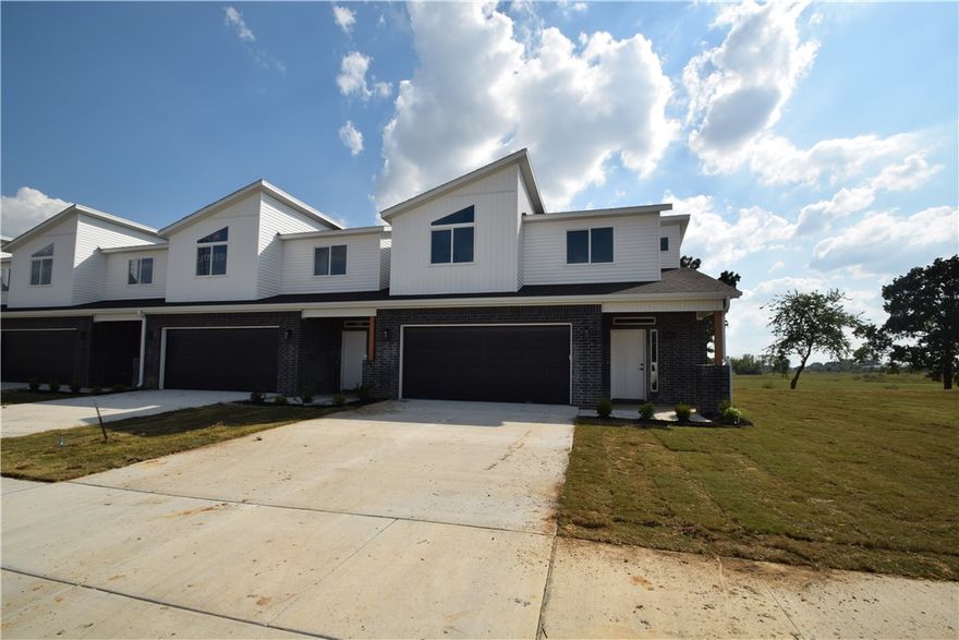 New modern design duplex! Also included brand new side by side stainless refrigerator, washer and dryer. This 4 bed 3 1/2 bath plan has an open living concept with tall ceilings and tons of natural light. Kitchen has granite countertops, stainless appliances, a large pantry. Primary suite is on the main floor and has a beautiful walk-in shower and a large walk-in closet. Three bedrooms upstairs with 2 full baths. Luxury Vinyl flooring in downstairs. 2" faux wood blinds and extra storage in the upstairs attic. Property has a private back patio and wood privacy fence. Owner must approve pets and no smoking.