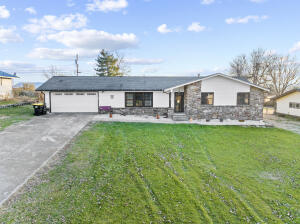 Enjoy quiet time from your covered patio looking onto your oversized backyard with above ground pool and storage building. The updated kitchen provides for an open floor plan not usually found in this neighborhood. Private master suite with updated master bath.. All one level home. Maintenance free home on the exterior with stone and newly installed vinyl siding. Most of the windows have been replaced as well. The bonus room has lots of possible uses. It can be a pantry, office, sewing room, workout space (currently not heated or cooled but is climate controlled from utility room.)